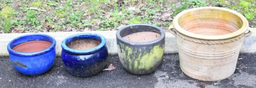 Four jardinieres / garden planters comprising three glazed and one terracotta pot with handles,