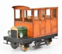 45mm gauge G scale railbus with glazed wooden body and vintage car style bonnet, driven by a battery