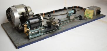 Norfolk watchmaker's or model engineering lathe on large base with motor and switchgear, fitted with