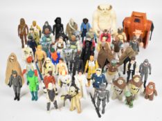Fifty two mostly vintage Star Wars action figures to include Darth Vader, Cloud City Luke Skywalker,