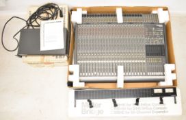 Home studio recording equipment comprising Mackie 8-Bus 24 channel mixing desk, external power