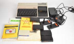 Texas Instruments TI-99/4A retro home computer together with controllers and software.
