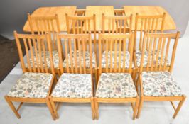 Ercol light elm extending table and eight chairs, W150 x D87 x H77cm