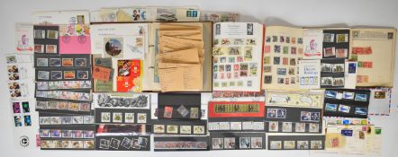 Collection of GB presentation packs and world stamps in Royal Mail Junior stamp album, Ace album and