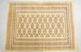 Fine wool / silk Turkoman rug with geometric borders on a beige ground, 128 x180cm