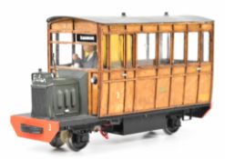 Fowler 45mm gauge G scale railbus with glazed wooden body and driver in cab, powered by a battery
