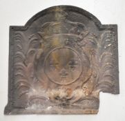 Antique cast iron or similar fire back with three fleur de lys to the centre, 60 x 59cm