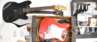 A collection of electric guitar parts and accessories to include bodies, necks, pickups, switches,