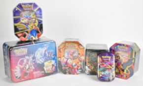 Pokémon TCG - Six collector tins containing a quantity of booster packs from Scarlet & Violet