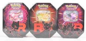 Pokémon TCG - Three Destined Rivals Team Rocket collector tins comprising Mewtwo, Nidoking and