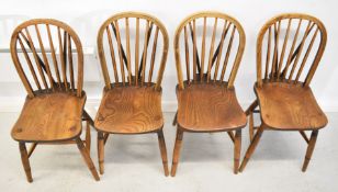 Eight elm seated chairs comprising four wheel back and four stick back examples