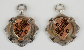 Two De Laune Cycling Club, London hallmarked silver medals with gold and enamel shields to front,