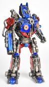 Transformers inspired recycled metal sculpture resembling Optimus Prime, height 34cm.