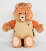 Worlds of Wonder Teddy Ruxpin animated talking bear with audio cassette, 1985, height 35cm sitting.