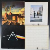 Four Pink Floyd LPs comprising Dark Side of the Moon, The Wall, Wish You Were Here and Animals.