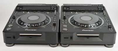 Two Pioneer DVJ-X1 pro DJ DVD mixers, one region 1 locked, the other displaying error code, for