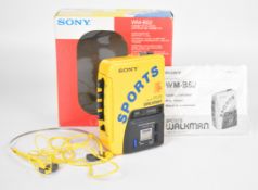 Sony Sports Walkman cassette player WM-B52, in original box with headphones and instructions.