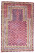 Afghan prayer rug on a wine ground with geometric borders, 145 x 95cm