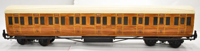 5 inch gauge LNER passenger coach with faux teak finish to the fibreglass bodyshell. Fitted with