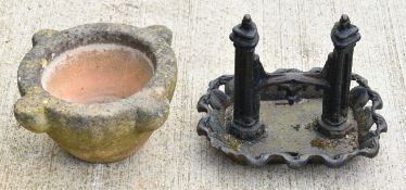 Victorian cast iron boot scraper and a stone mortar, largest W36cm