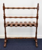 Mahogany riding or Wellington boot stand to accommodate six pairs of boots and with twelve pegs