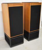 Linn Isobarik speakers in walnut finish with stands and crossovers, serial nos. 008337 and 008338,