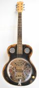 Unbranded electro resonator guitar with composite body, rosewood fretboard and pearlescent inlays.