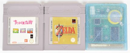 Three Nintendo Game Boy computer game cartridges comprising Pokémon Crystal, The Legend of Zelda: