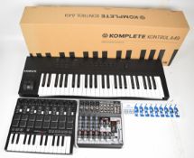Home studio recording equipment comprising Native Instruments Komplete Kontrol A49 keyboard,