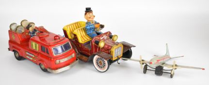 Three battery operated and friction driven tinplate toys comprising Smokey Bill, Chemical
