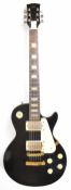 Hondo Les Paul style electric guitar in black finish with cream trim, humbucker pickups, rosewood