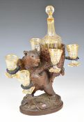 19th/20thC carved Black Forest bear liqueur set or tantalus with decorative gilded decanter and