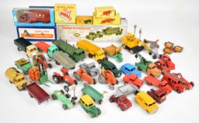 A collection of vintage Dinky and similar diecast model cars, trucks and agricultural vehicles to