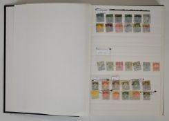 Commonwealth stamp collection in black stock book with early issues of many countries including