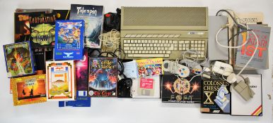 Atari 520ST retro home computer in original box with disk drive, mouse, joystick, controllers, power