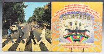 Two Beatles LPs comprising Abbey Road (PCS 7088) misprint with the Apple misaligned to the left on