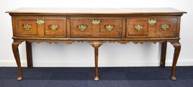 18thC inlaid oak sideboard or dresser base with three straight drawers and shaped apron, raised on