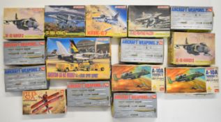 Fifteen Japanese 1:144 scale plastic model military aircraft kits by Dragon and LS Models, in