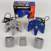 Nintendo 64 (N64) accessories comprising two controllers (one boxed), two Game Boy Transfer Paks and
