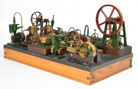 Display of nine live steam oscillating engines to include two twin cylinder engines and three double
