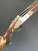 Browning 325 12 bore over and under ejector shotgun with named and engraved action and underside,