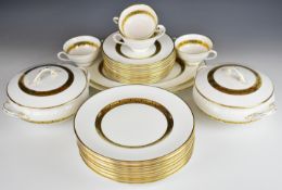 Coalport dinner and tea ware decorated in the Citation pattern with gold banding and black leaf