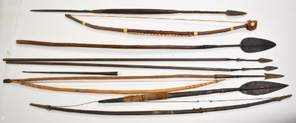 Nine tribal bows / short spears, mainly African, longest 144cm. PLEASE NOTE: WE ARE NOT ABLE TO