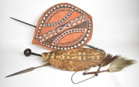 Two African tribal hide shields, two fly whisks, knobkerrie, spears etc