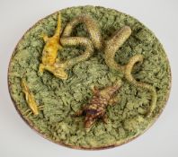 19thC Portuguese Palissy charger with relief moulded decoration of a snake with a lizard in its