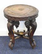 19thC Anglo Indian carved low table / jardiniere stand with figural elephant supports, diameter 36 x