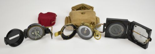 Three military compasses comprising a British WW2 marching compass Mark 1, marked T.G.Co.Ltd and
