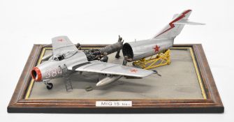 1/43 scale Cold War model diorama of a Soviet MIG-15 being prepared for flight, with maintenance