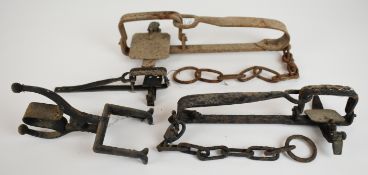 Four vintage animal traps including a mole trap, longest 31cm