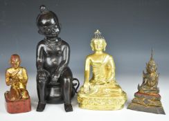 Four bronze / carved wood Buddha /deities, tallest 34cm